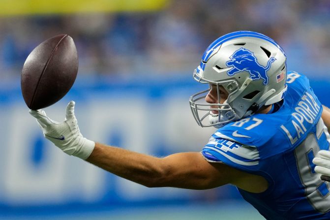 Detroit Lions tight end Sam LaPorta tries in vain to pull in a pass reception in Detroit on Sunday, October 8. The Lions beat the Carolina Panthers 42-24.