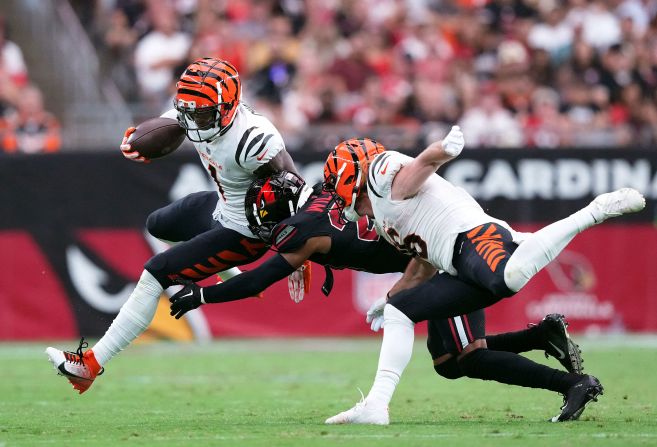 Cincinnati Bengals wide receiver Ja'Marr Chase runs past Arizona Cardinals cornerback Marco Wilson after making a catch during the Bengals' 34-20 victory over the Cardinals on October 8. Chase scored three touchdowns during the game.