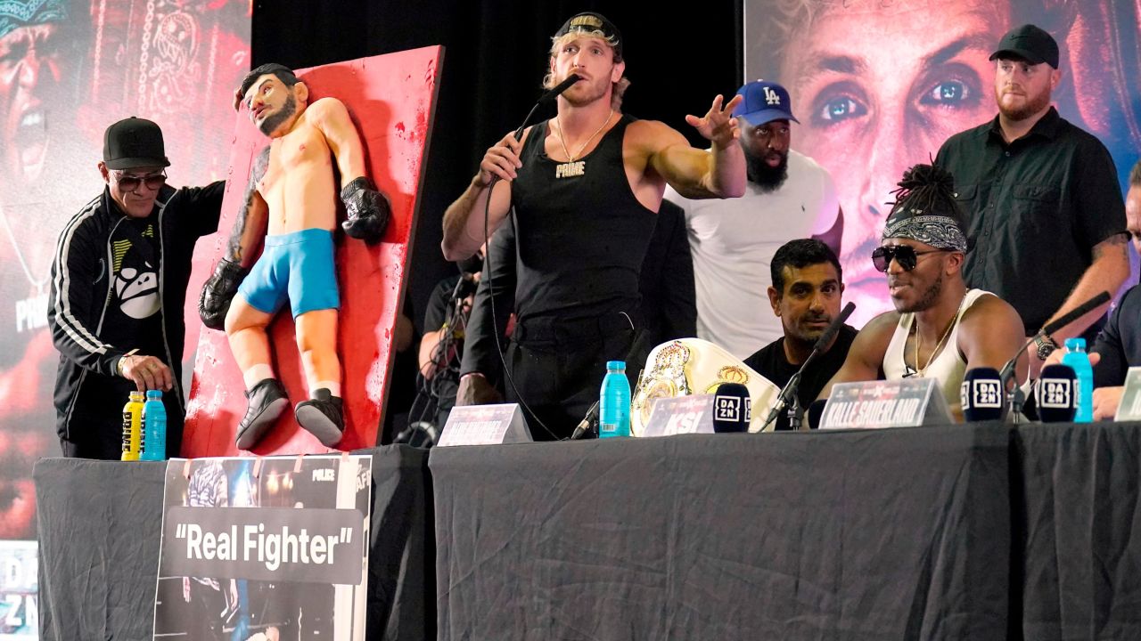 Logan Paul with a cake during a press conference at the OVO Arena Wembley, London. Picture date: Tuesday August 22, 2023. 73418372 (Press Association via AP Images)