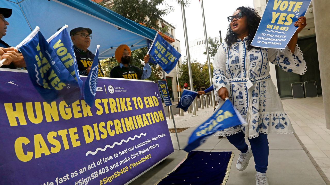 Thenmozhi Soundararajan, right, of Equality Labs, leads a rally to pass a California law banning caste discrimination in September 2023.