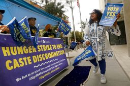 Thenmozhi Soundararajan, right, of Equality Labs, leads a rally to pass a California law banning caste discrimination in September 2023. 