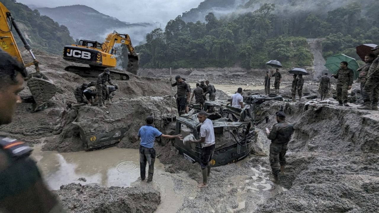 Members of Indian Army try to recover buried trucks in Sikkim on October 5, 2023. 