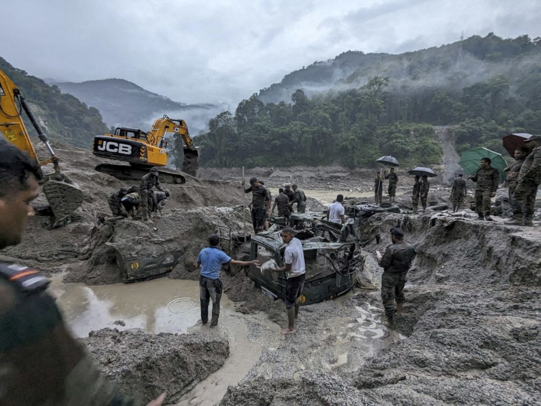 Members of Indian Army try to recover buried trucks in Sikkim on October 5, 2023. 