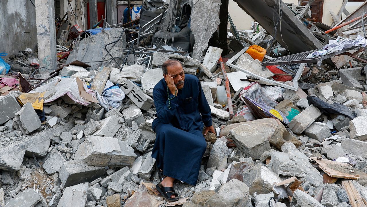 A Palestinian sits on the rubble of a building destroyed in Israeli strikes, in Rafah in the southern Gaza Strip October 9, 2023. REUTERS/Ibraheem Abu Mustafa

     TPX IMAGES OF THE DAY     
