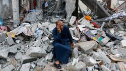 A Palestinian sits on the rubble of a building destroyed in Israeli strikes, in Rafah in the southern Gaza Strip October 9, 2023. REUTERS/Ibraheem Abu Mustafa

     TPX IMAGES OF THE DAY     