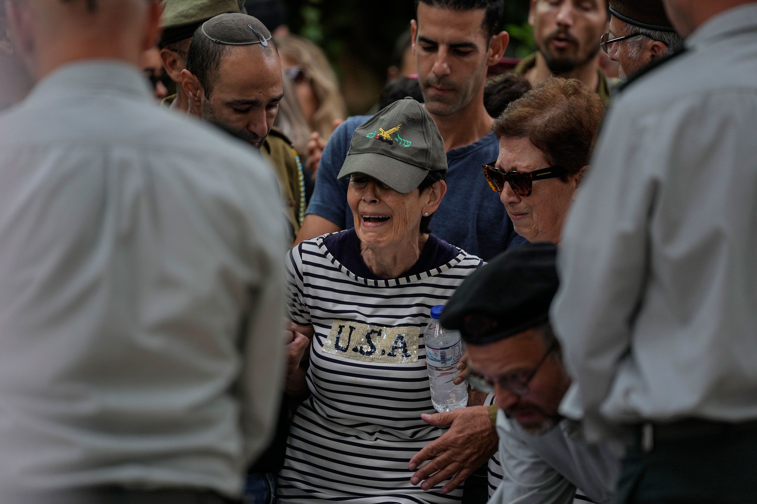 The mother of Israeli Col. Roi Levy cries during her son's funeral at the Mount Herzl cemetery in Jerusalem on October 9.