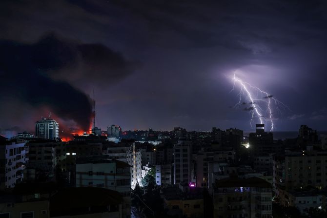 Lightning strikes over Gaza City following an Israeli bombardment on October 9.