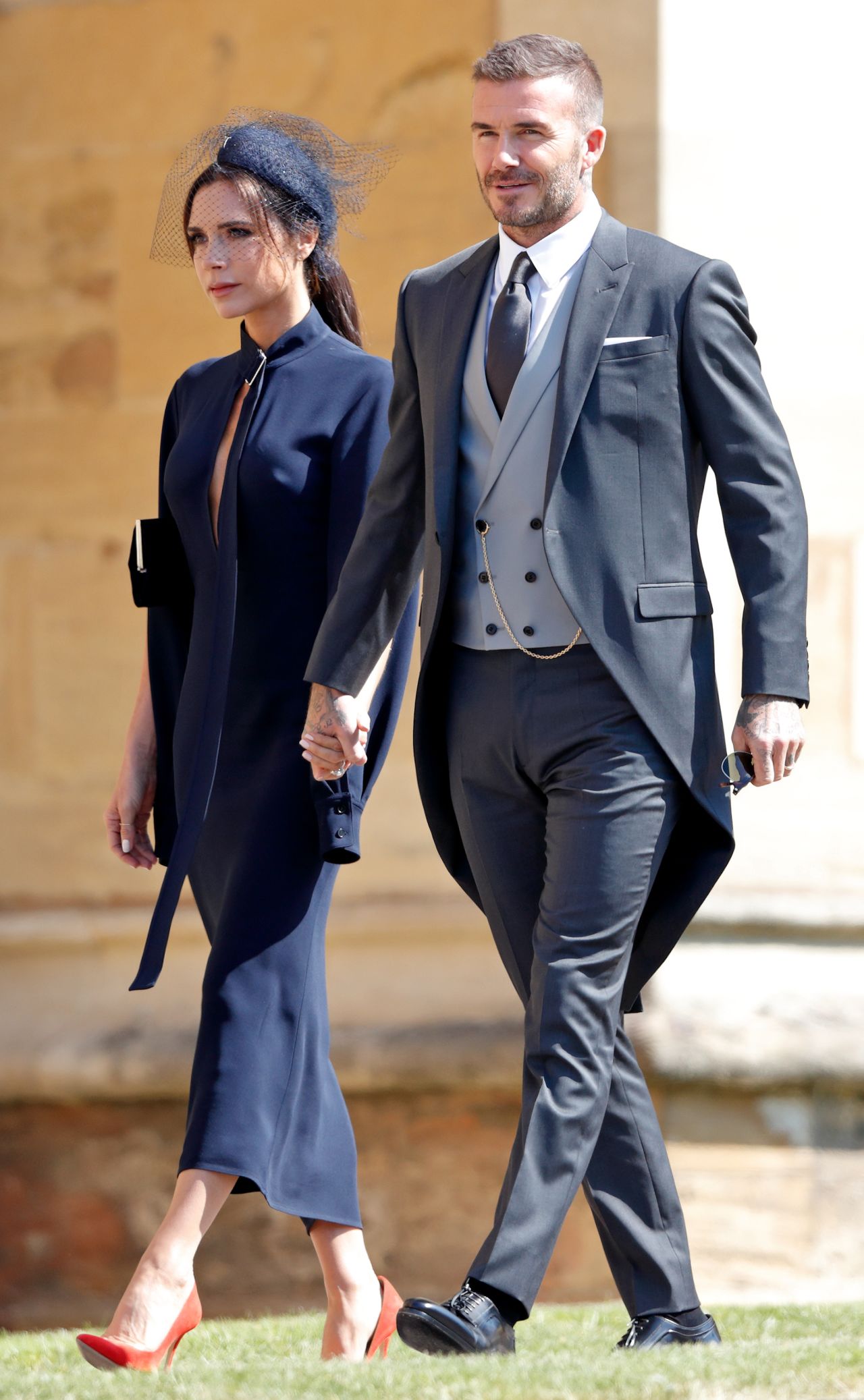 Victoria Beckham and David Beckham attend the wedding of Prince Harry to Ms Meghan Markle at St George's Chapel, Windsor Castle on May 19, 2018 in Windsor, England. Prince Henry Charles Albert David of Wales marries Ms. Meghan Markle in a service at St George's Chapel inside the grounds of Windsor Castle. Among the guests were 2200 members of the public, the royal family and Ms. Markle's Mother Doria Ragland. (Photo by Max Mumby/Indigo/Getty Images)