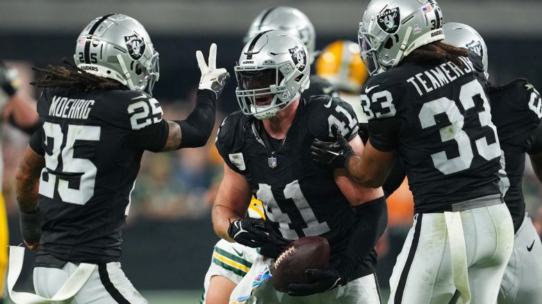 LAS VEGAS, NEVADA - OCTOBER 09: Robert Spillane #41 of the Las Vegas Raiders celebrates with teammates after intercepting the ball during the fourth quarter against the Green Bay Packers at Allegiant Stadium on October 09, 2023 in Las Vegas, Nevada. (Photo by Chris Unger/Getty Images)