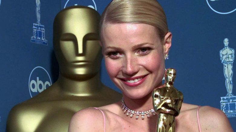 Gwyneth Paltrow poses backstage with her best actress Oscar for her role in "Shakespeare in Love," at the 71st Annual Academy Awards at the Dorothy Chandler Pavilion of the Los Angeles Music Center Sunday, March 21, 1999. (AP Photo/Reed Saxon)