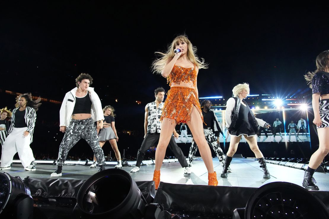 Taylor Swift performs onstage during her "Eras Tour" in July.