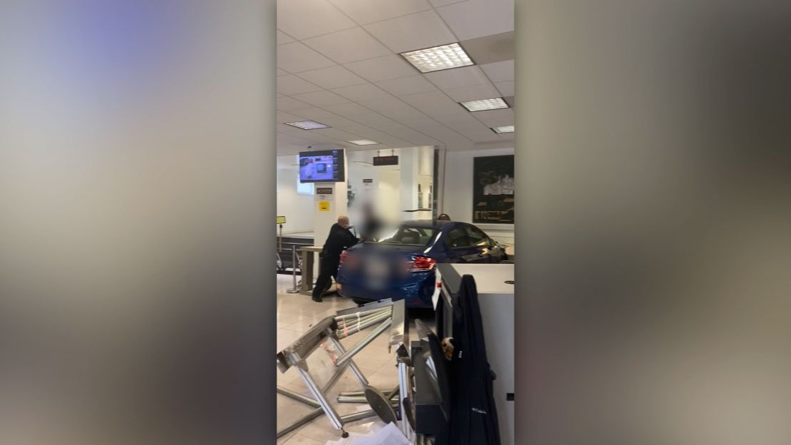 Videos recorded by Sergii Molchanov show the car crashed into the consulate on October 9 and debris scattered on the ground as people ran out of the building.