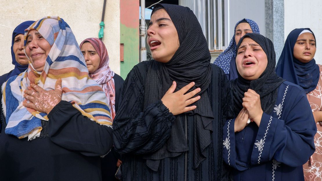 Women mourn during the funeral of Palestinians killed in overnight Israeli shelling in the southern Gaza Strip on Tuesday.