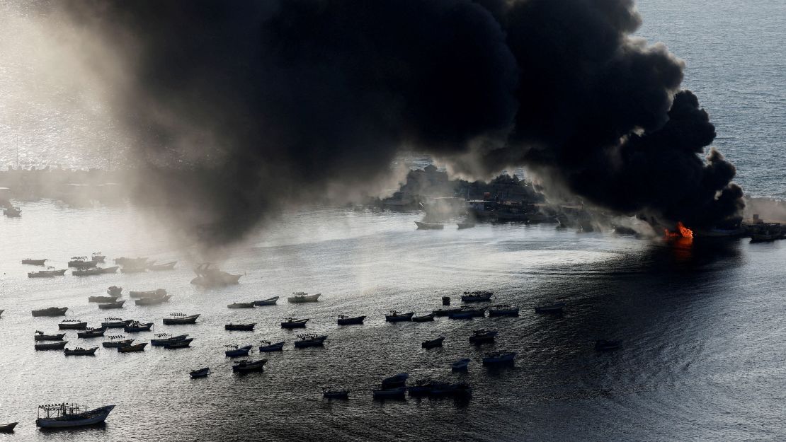Smoke rises following Israeli strikes on the seaport of Gaza City, in Gaza on Tuesday.