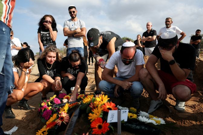 People mourn at the grave of Eden Guez during her funeral in Ashkelon, Israel, on October 10. She was killed as she attended a music festival that was <a href="index.php?page=&url=https%3A%2F%2Fwww.cnn.com%2F2023%2F10%2F07%2Fmiddleeast%2Fisrael-gaza-fighting-hamas-attack-music-festival-intl-hnk%2Findex.html" target="_blank">attacked by terrorists from Gaza</a>. Israeli officials counted at least 260 bodies at the Nova Festival.