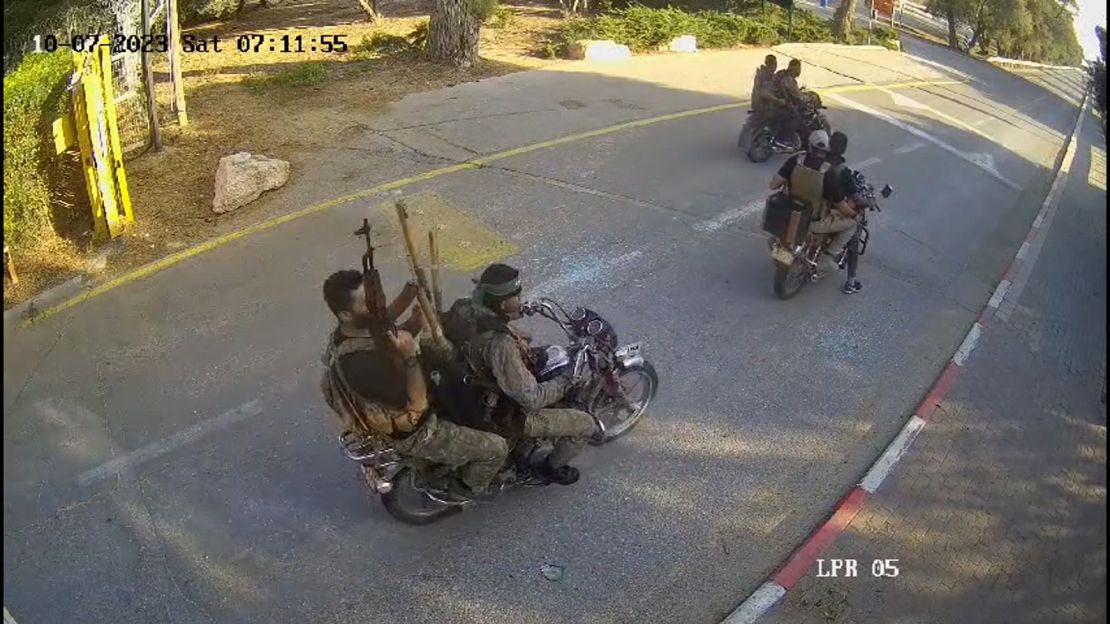 A screenshot from a video, geolocated by CNN, shows six Hamas militants arriving at Be'eri on Saturday morning local time.
