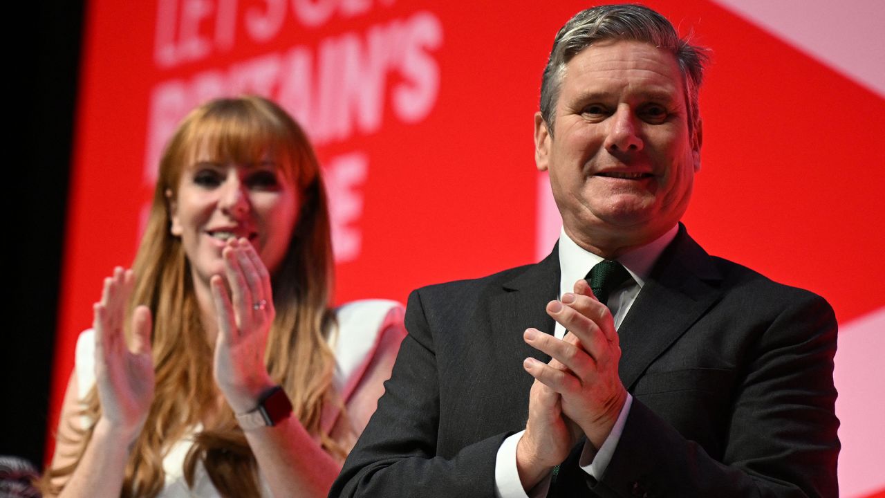 Britain's main opposition Labour Party deputy leader and Shadow Levelling Up, Housing and Communities Secretary Angela Rayner (L) and Britain's main opposition Labour Party leader Keir Starmer applaud Britain's main opposition Labour Party Shadow Chancellor of the Exchequer Rachel Reeves (unseen) after she addressed delegates on the second day of the annual Labour Party conference in Liverpool, northwest England, on October 9, 2023. (Photo by Paul ELLIS / AFP) (Photo by PAUL ELLIS/AFP via Getty Images)