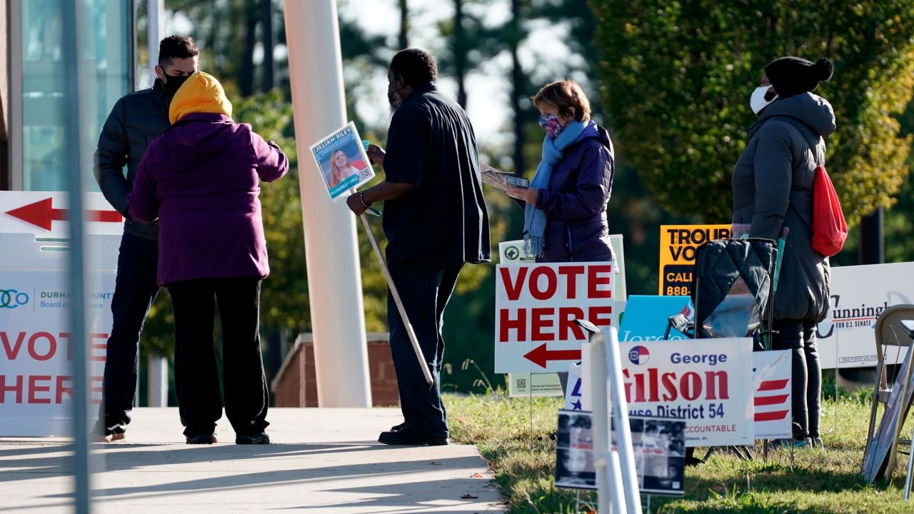 Voters are assisted at a polling location in Durham, North Carolina, on November 3, 2020. 