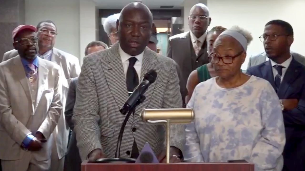 Marsha Ervin, right, stands next to attorney Ben Crump during a news conference in Tallahassee on Tuesday.