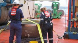 Coast Guard marine safety engineers assigned to the Marine Safety Center in Washington D.C., working for the Marine Board of Investigation for the Titan submersible case, conduct a survey of the aft titanium endcap from Titan in the North Atlantic Ocean Oct. 1, 2023. The endcap was recently recovered from the seafloor and successfully transferred to a U.S. port for analysis. (Photo courtesy of the U.S. National Transportation Safety Board)