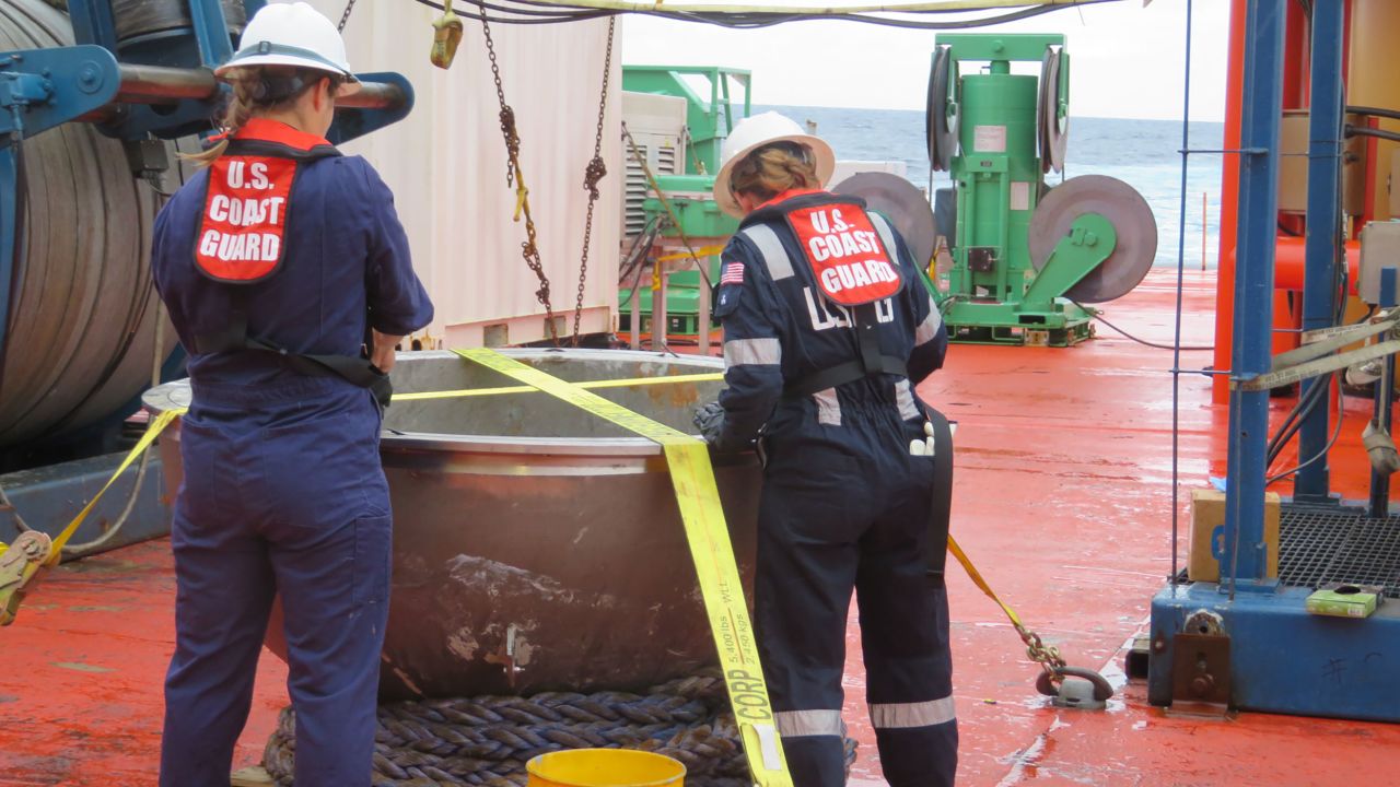 Coast Guard marine safety engineers conduct a survey of the aft titanium endcap from Titan in the North Atlantic Ocean on October 1.