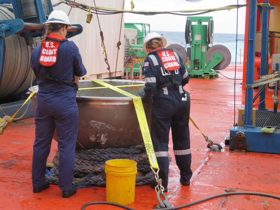Coast Guard marine safety engineers conduct a survey of the aft titanium endcap from Titan in the North Atlantic Ocean on October 1.

