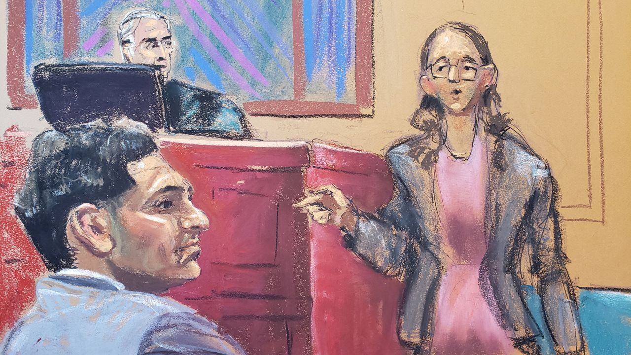 Former crypto hedge fund Alameda Research CEO Caroline Ellison points out Sam Bankman-Fried during his fraud trial in New York City on October 10, 2023, in this courtroom sketch. 