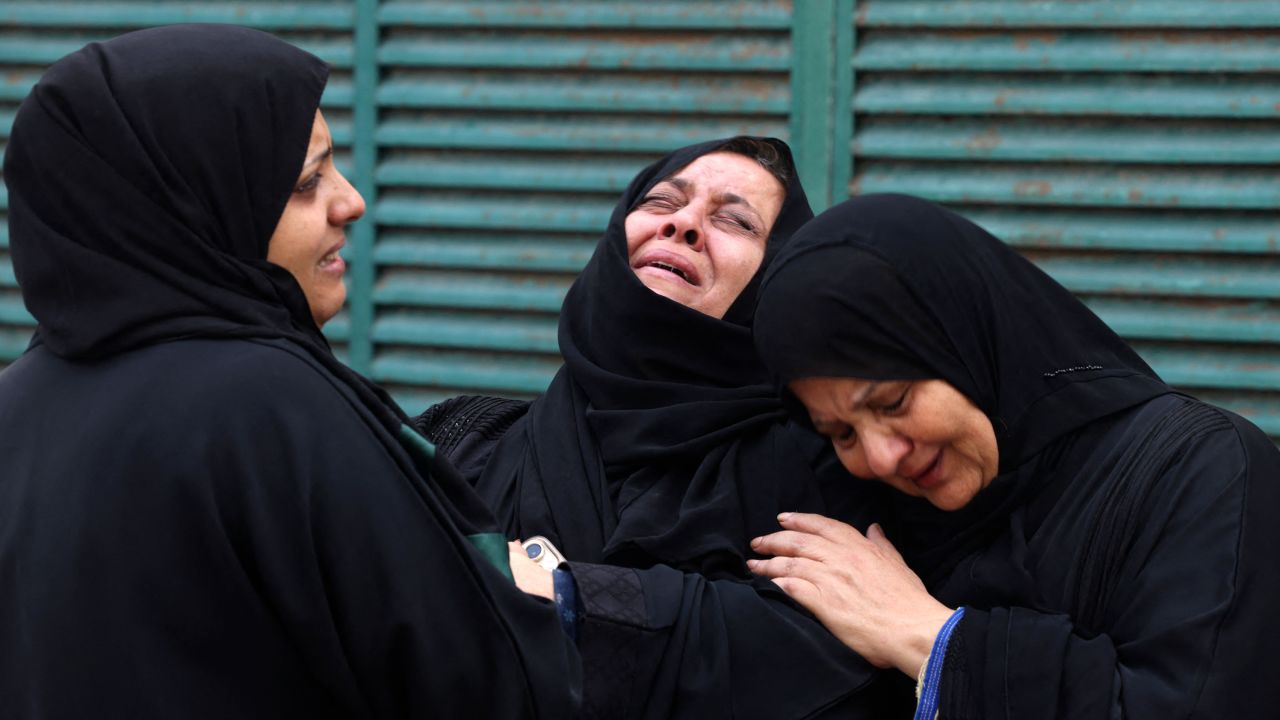 Palestinians mourn during the funeral of a relative, killed in an Israeli strike, in Gaza City on October 10, 2023. Israel said it recaptured Gaza border areas from Hamas as the war's death toll passed 3,000 on October 10, the fourth day of gruelling fighting since the Islamists launched a surprise attack. (Photo by MOHAMMED ABED / AFP) (Photo by MOHAMMED ABED/AFP via Getty Images)