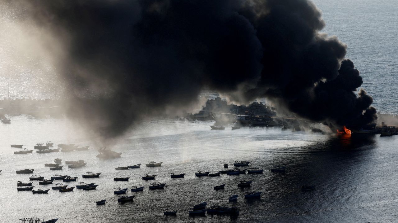 Smoke rises after Israeli strikes on the seaport of Gaza City on October 10. 