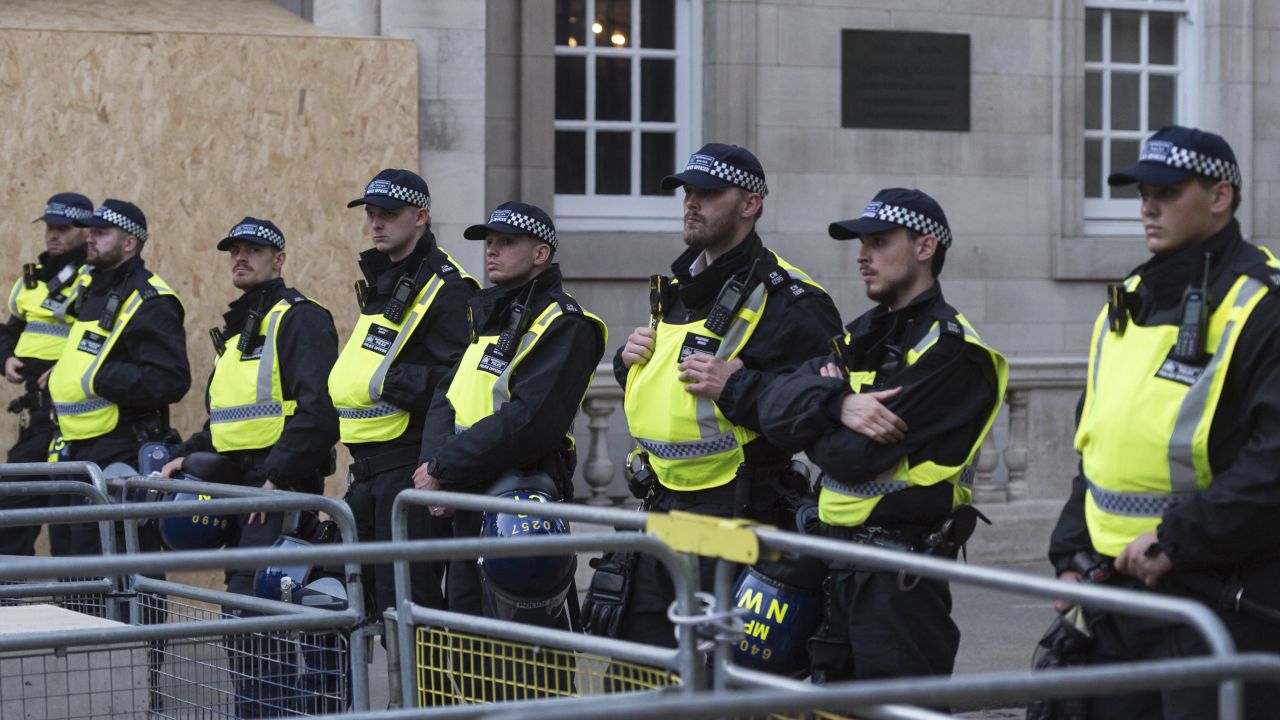 Police officers stand guard as Palestinian supporters gather outside Israel's embassy in London on October 9. 