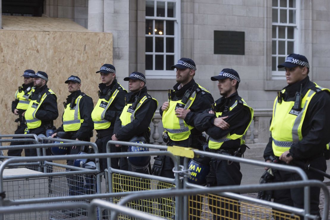 Police officers stand guard as Palestinian supporters gather outside Israel's embassy in London on October 9. 