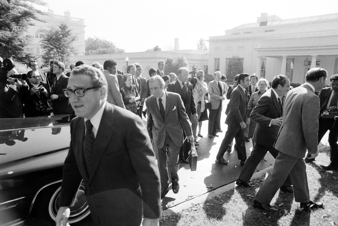 Kissinger hurries back to the State Department after meeting with Nixon (to the right with chief-of-staff Al Haig) after discussing the Yom Kippur War, which was raging in Israel in 1973. 