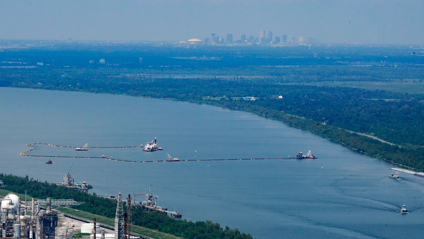 In this aerial photo, dredging operations to build an underwater sill are seen, with the city of New Orleans in the background.