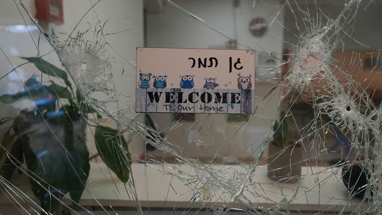 A bullet-shuttered window of the entrance to a kindergarten in Kibbutz Be'eri on Wednesday, Oct. 11, 2023. 