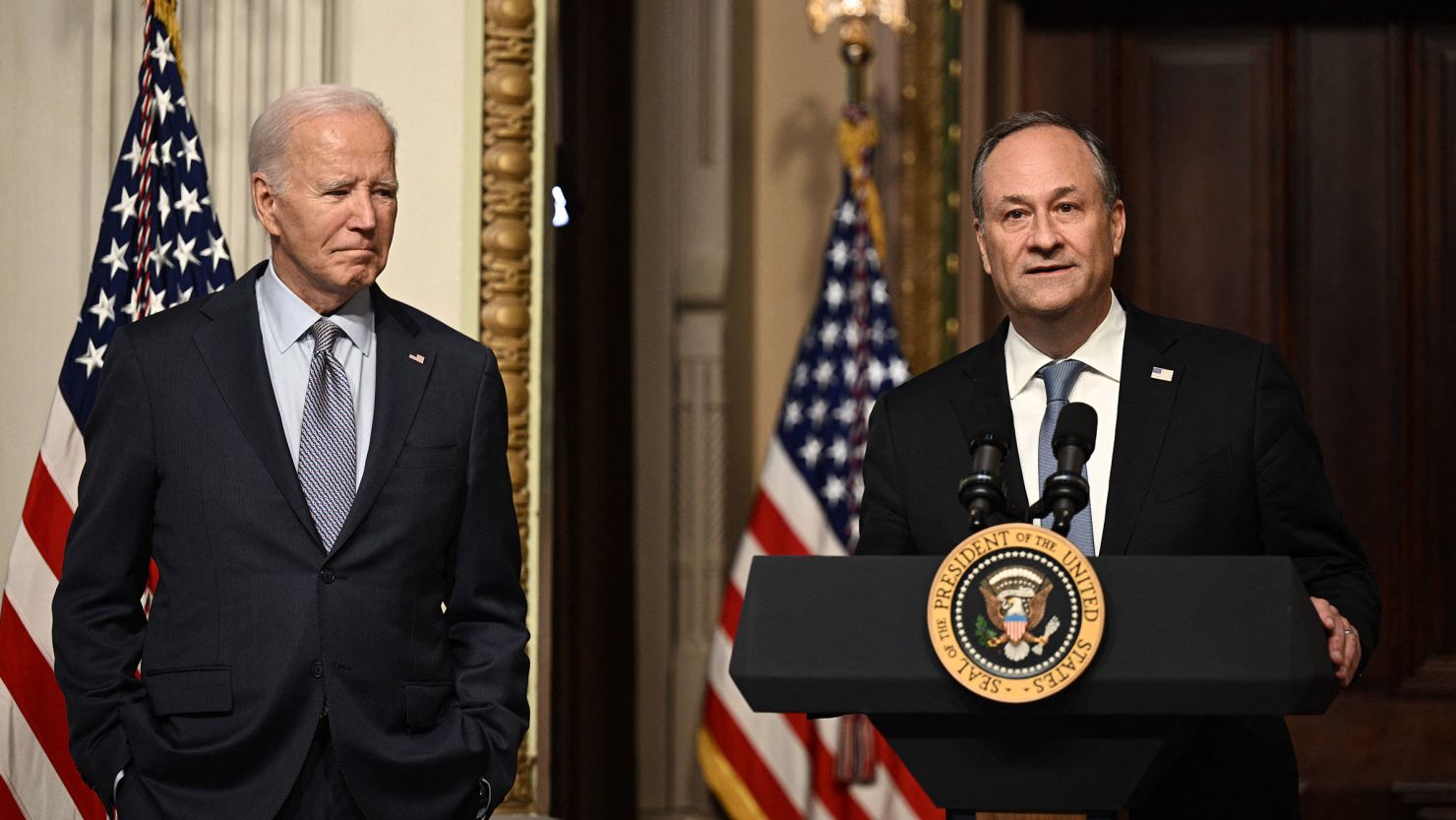 US President Joe Biden listens to Second Gentleman Doug Emhoff speak at a roundtable with Jewish community leaders in the Indian Treaty Room of the White House on October 11, 2023. 