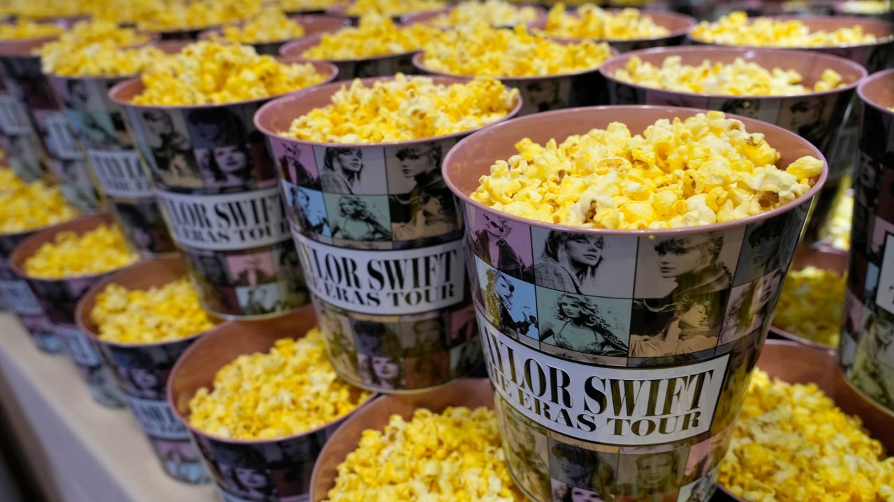 Popcorn packaged in decorative containers is on display at the premiere.