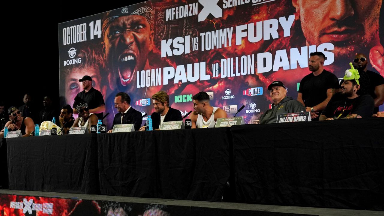 Left to right, Jake Paul, KSI, boxing promoter Kalle Sauerland, Joe Markowski, Tommy Fury, John Fury and Dillon Danis during a press conference at the OVO Arena Wembley, London. Picture date: Tuesday August 22, 2023. 73419020 (Press Association via AP Images)