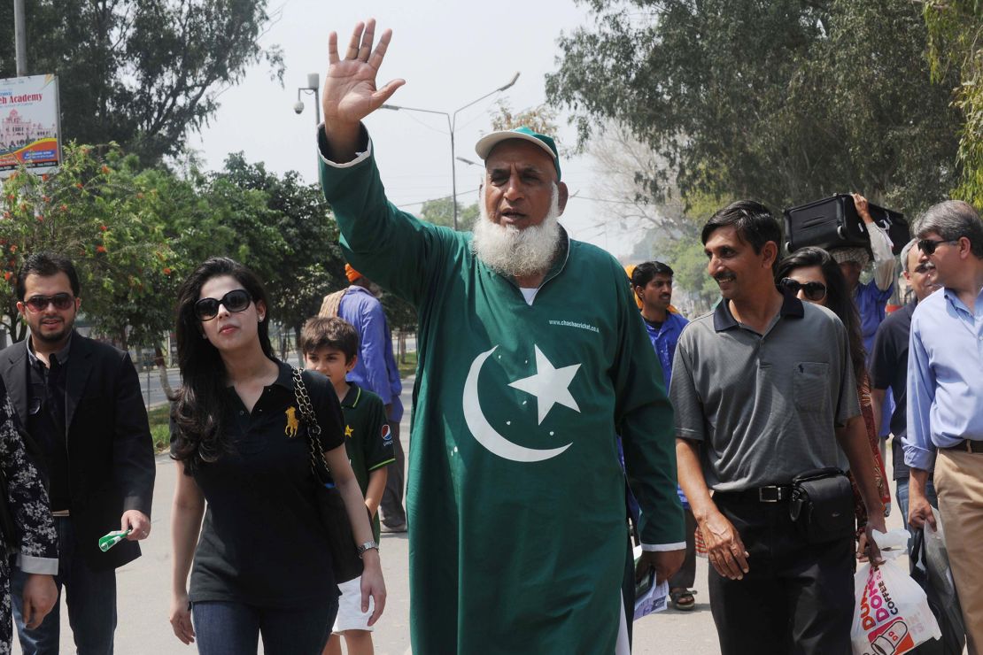 Chaudhry Abdul Jalil, popularly known as Chacha Cricket, waves after crossing the India-Pakistan border in Wagah on March 29, 2011, on the eve of the India-Pakistan Cricket World Cup semi-final match.