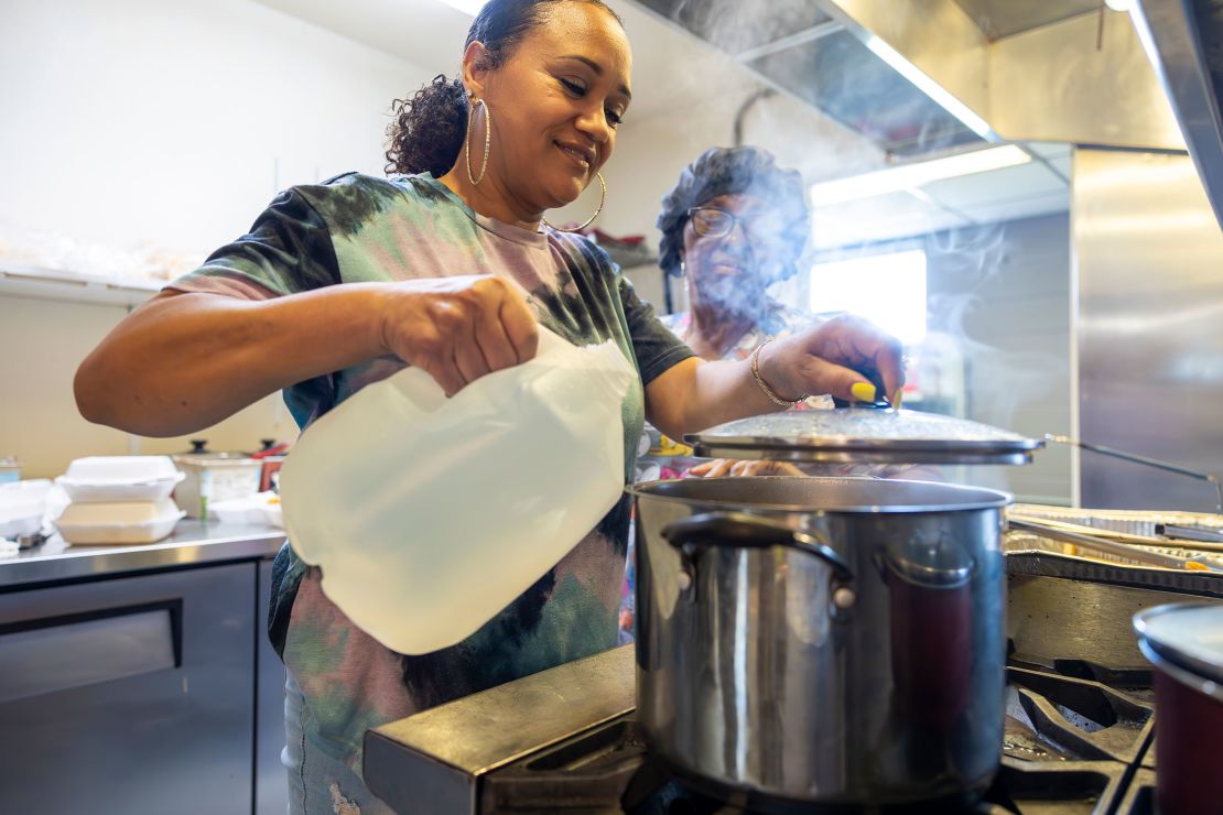 Ashara Feloss uses bottled water for cooking at DJ's One Stop, a lunch place in Plaquemines Parish, in late September. The water in Plaquemines had been salty since early summer before the Army Corps began barging freshwater there in early October.