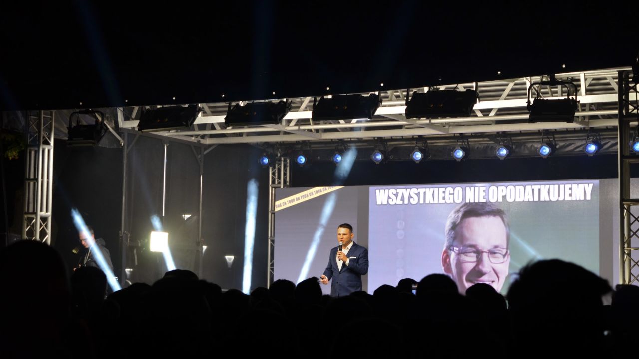 Confederation's rallies at times resemble a rock concert, and at others a stand-up routine. The group's young co-leader cycles through memes, mocking the major players in Polish politics.