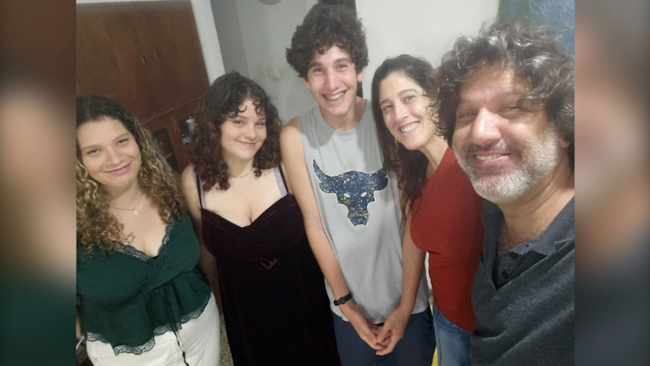 Deborah and Shlomi Matias pose for a photo with their children.