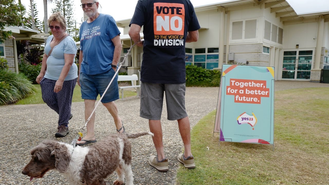A No campaign worker hands out leaflets outside an early voting center on October 4, in Ballina, Australia. 