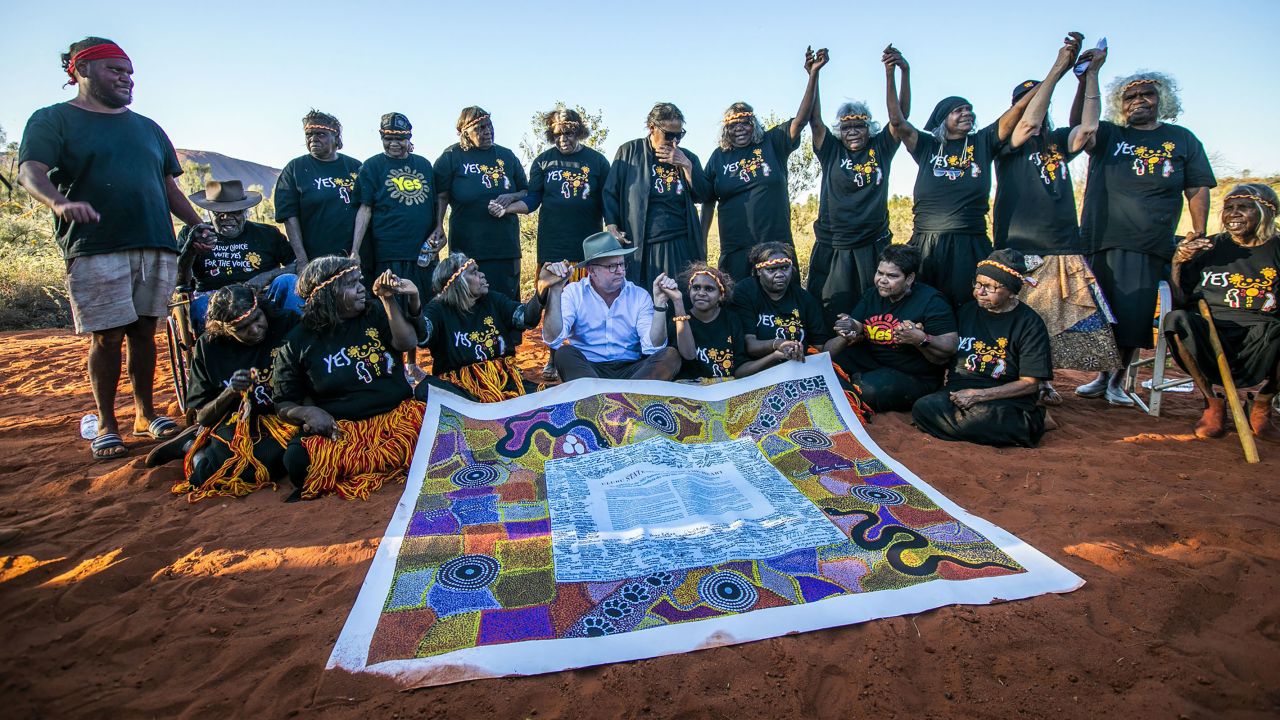 Australian Prime Minister Anthony Albanese sits with Indigenous leaders in the Uluru Kata Tjuta National Park in central Australia on October 10, 2023. 