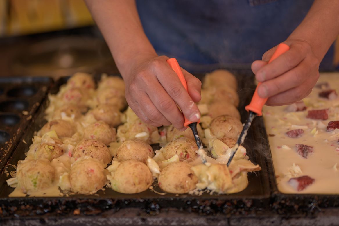 <strong>Takoyaki:</strong> These fried octopus balls are a popular takeaway food as they're easy to eat on the go.