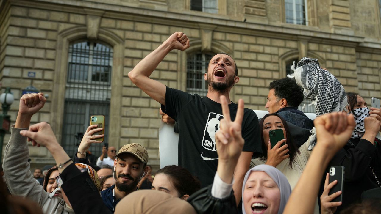 Protestors chant as they gather at Place de la Republique on October 12, 2023. 