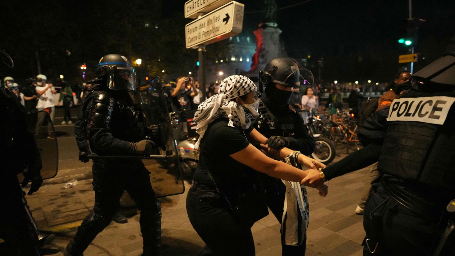 A protestor is detained by French Police during an unauthorized demonstration in support of Palestinians at Place de la Republique, in Paris, on October 12, 2023. 