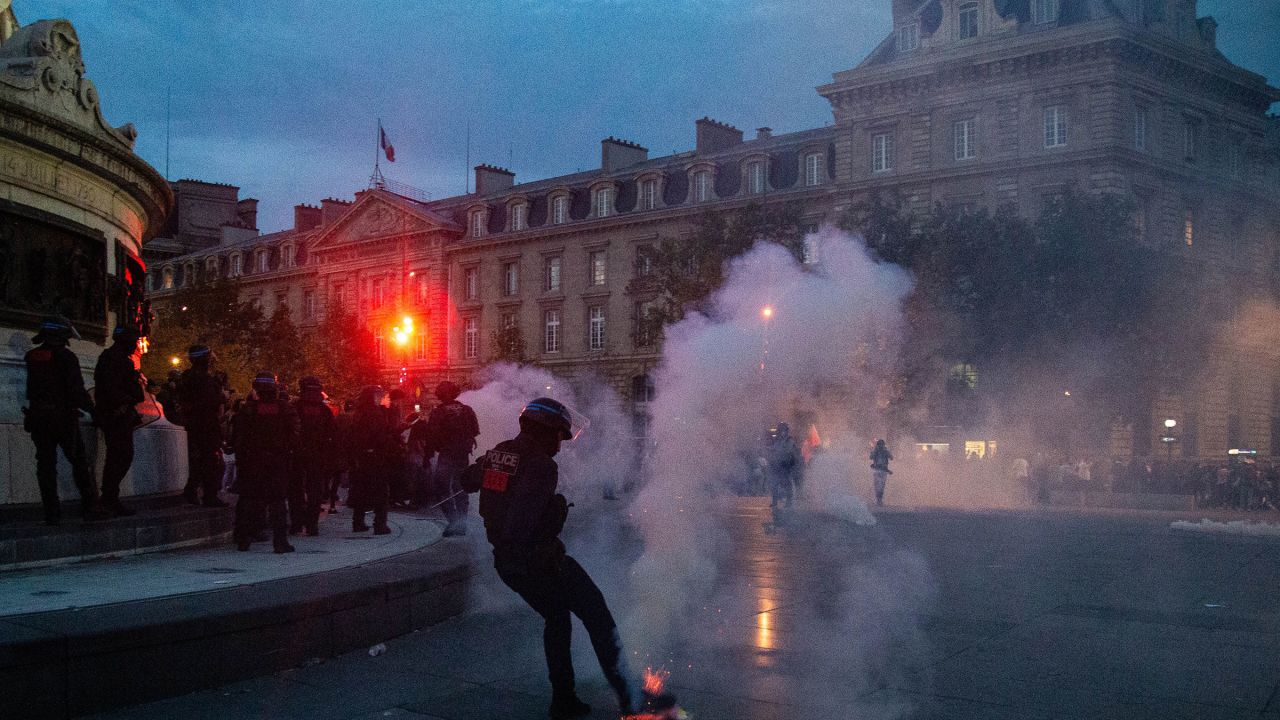 French riot police disperse demonstrators in Paris on October 12, 2023. 