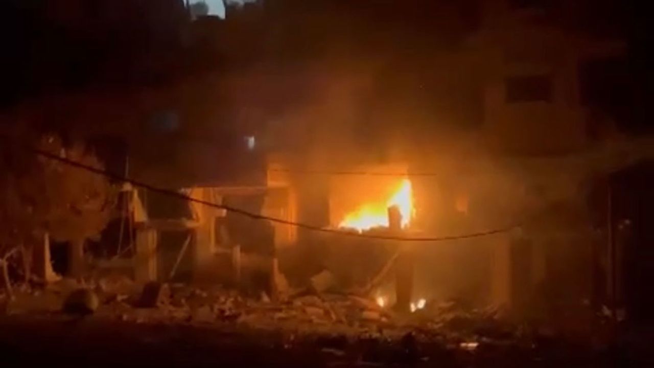 Maisara Baroud's building on fire following an Israeli airstrike.