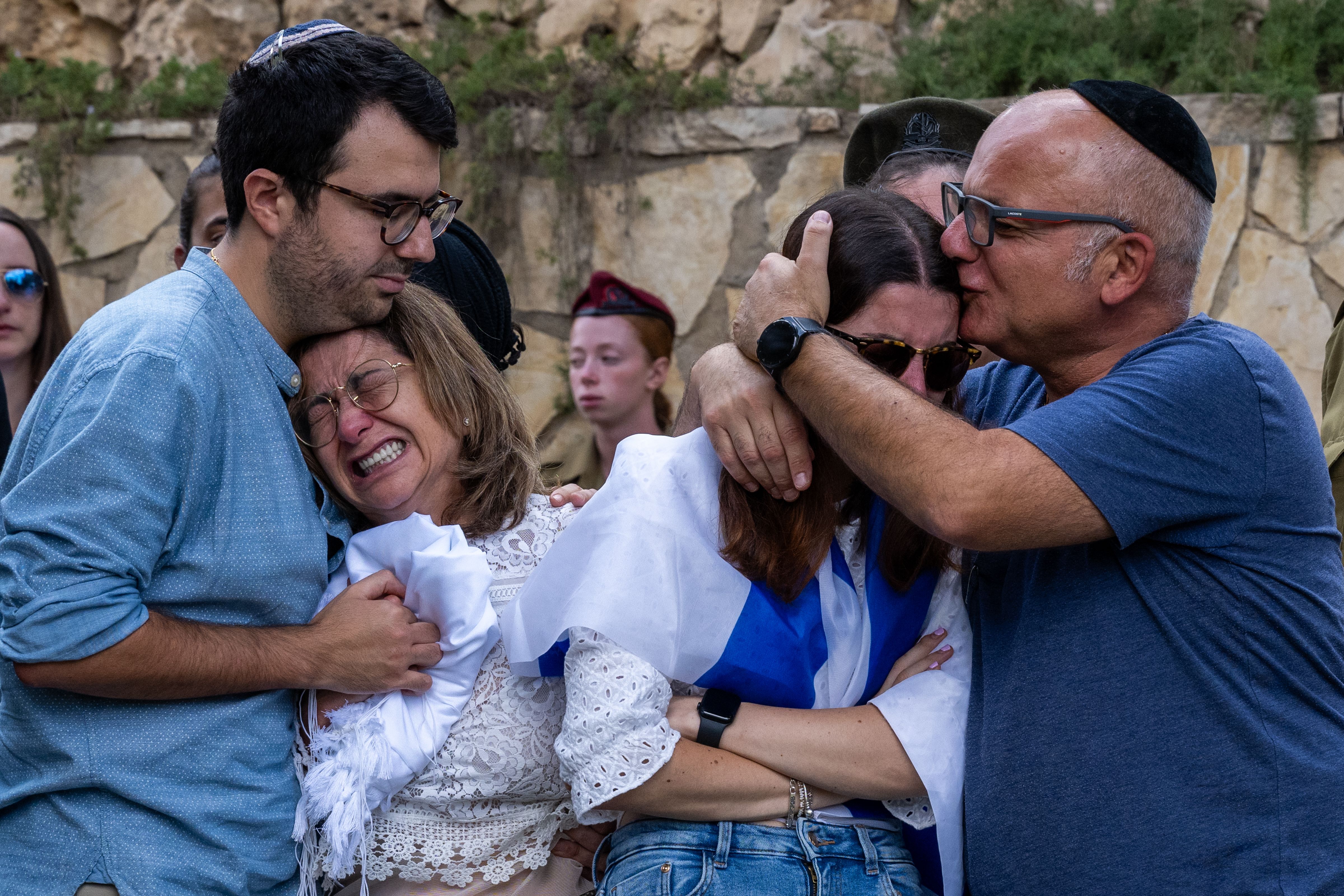 Family members of Valentin Ghnassia react during his funeral ceremony at the Mount Herzl Military Cemetery in Jerusalem on October 12. Ghnassia was killed in a battle with Hamas militants in Be'eri, Israel.