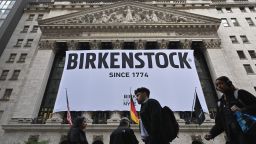 TOPSHOT - A Birkenstock banner hangs outside the New York Stock Exchange (NYSE) in New York on October 11, 2023, as Birkenstock launches an Initial Public Offering (IPO). German sandals maker Birkenstock has set its share price at $46, the firm said in a press release early Wednesday. A total of 32.26 million ordinary shares will be offered in its initial public offering, trading under the symbol BIRK. (Photo by ANGELA WEISS / AFP) (Photo by ANGELA WEISS/AFP via Getty Images)